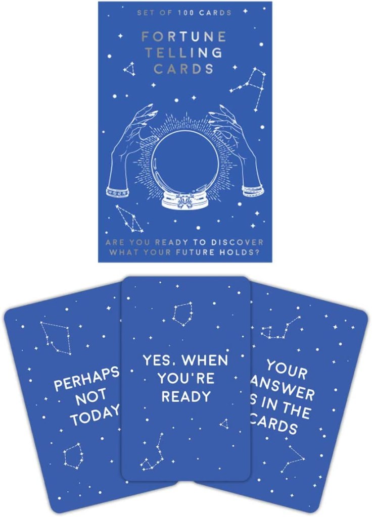 box of blue fortune telling cards and white line illustration of hands and glass ball, a great gift idea for mom on Mother's Day