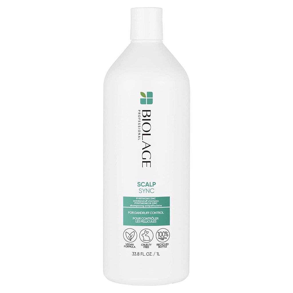 dry scalp treatment in white bottle with some green color on the label